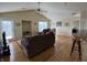 Spacious living room with hardwood floors, vaulted ceilings, and a cozy seating area at 706 Shagbark Ct, Plainfield, IN 46168