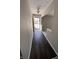 Front entry with dark vinyl flooring and view of the front yard at 721 Leisure Ln, Greenwood, IN 46142