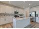 Modern kitchen with white cabinets, quartz countertops, and stainless steel appliances at 7384 Cambridge Pl, Avon, IN 46123