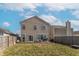 Back exterior shows a well maintained yard and neutral colored siding at 7730 Belmac Ln, Camby, IN 46113