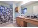 The bathroom offers a single vanity and shower with lovely decorative floral shower curtain at 7730 Belmac Ln, Camby, IN 46113