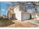 Attractive home featuring a two-car garage, quaint porch, and well-kept front yard in a desirable location at 7730 Belmac Ln, Camby, IN 46113