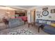 Cozy living area with comfortable furniture and an open layout connecting to the dining area at 7730 Belmac Ln, Camby, IN 46113