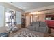 Bright living area featuring stylish decor, plush seating and a view into the dining area at 7730 Belmac Ln, Camby, IN 46113