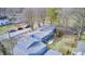 Aerial view showcasing a blue house with a sizable backyard and detached garage at 940 W 53Rd St, Indianapolis, IN 46208