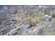 Aerial view of a residential neighborhood with mature trees and a river at 940 W 53Rd St, Indianapolis, IN 46208