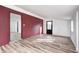 Spacious basement with LVP flooring and an accent wall at 940 W 53Rd St, Indianapolis, IN 46208