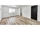 Bright bedroom with LVP flooring and access to bath at 940 W 53Rd St, Indianapolis, IN 46208