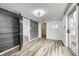 Bright dining room featuring wood-look floors and access to deck at 940 W 53Rd St, Indianapolis, IN 46208