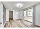 Bright dining room with wood-look floors and sliding glass doors to deck at 940 W 53Rd St, Indianapolis, IN 46208