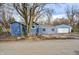 Ranch home with detached garage, updated siding, and mature trees at 940 W 53Rd St, Indianapolis, IN 46208