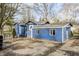 Blue house with detached garage and a spacious yard at 940 W 53Rd St, Indianapolis, IN 46208