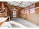 Unfinished garage with ample storage and workbenches at 940 W 53Rd St, Indianapolis, IN 46208