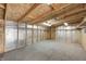 Partially finished garage with wood shelving and pegboard at 940 W 53Rd St, Indianapolis, IN 46208