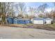 Blue house with attached garage and driveway at 940 W 53Rd St, Indianapolis, IN 46208