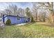 Side view of a blue house with landscaping at 940 W 53Rd St, Indianapolis, IN 46208