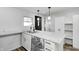 Modern kitchen with white cabinets and marble countertops at 940 W 53Rd St, Indianapolis, IN 46208