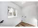 Simple laundry room with wood-look flooring at 940 W 53Rd St, Indianapolis, IN 46208