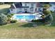 Backyard oasis: home with pool, patio, and lush landscaping at 10100 Sanctuary Dr, Brownsburg, IN 46112