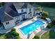 Luxury home with inground pool, patio, and landscaping at 10100 Sanctuary Dr, Brownsburg, IN 46112