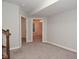 Finished basement hallway with doors to additional rooms at 10100 Sanctuary Dr, Brownsburg, IN 46112