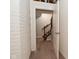 Basement stairs with wood railing and carpeted flooring at 10100 Sanctuary Dr, Brownsburg, IN 46112