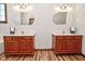 Bathroom with double vanity and elegant mirrors at 10100 Sanctuary Dr, Brownsburg, IN 46112