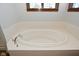 Oval soaking tub in a stylish bathroom at 10100 Sanctuary Dr, Brownsburg, IN 46112