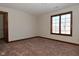 Well-lit bedroom with carpet and large window at 10100 Sanctuary Dr, Brownsburg, IN 46112