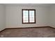 Bright bedroom featuring a large window and carpet at 10100 Sanctuary Dr, Brownsburg, IN 46112