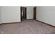 Spacious bedroom with neutral carpeting and wood trim at 10100 Sanctuary Dr, Brownsburg, IN 46112