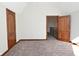 Large bedroom with wood doors and neutral carpeting at 10100 Sanctuary Dr, Brownsburg, IN 46112