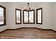 Dining room featuring hardwood floors, bay windows, and chandelier at 10100 Sanctuary Dr, Brownsburg, IN 46112
