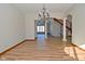 Spacious dining room featuring hardwood floors and a chandelier, open to other areas at 10100 Sanctuary Dr, Brownsburg, IN 46112