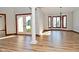 Bright dining room with hardwood floors, large windows, and chandelier at 10100 Sanctuary Dr, Brownsburg, IN 46112