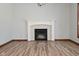 Gas fireplace with white mantel in living room at 10100 Sanctuary Dr, Brownsburg, IN 46112