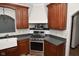 Corner kitchen with gas range and microwave at 10100 Sanctuary Dr, Brownsburg, IN 46112
