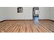 Hardwood floor living room with views into kitchen and other rooms at 10100 Sanctuary Dr, Brownsburg, IN 46112