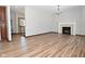 Living room with hardwood floors and fireplace at 10100 Sanctuary Dr, Brownsburg, IN 46112