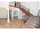 Elegant staircase with ornate railing and hardwood floors at 10100 Sanctuary Dr, Brownsburg, IN 46112