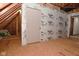 Unfinished attic room with door to potential future living space at 10100 Sanctuary Dr, Brownsburg, IN 46112