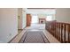 Spacious entryway with tiled floor and wooden staircase at 1013 Hudson Bay Dr, Greenwood, IN 46142