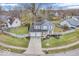 Charming two-story home features a well-manicured lawn and a two-car garage at 11237 Baycreek Dr, Indianapolis, IN 46236