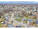 Aerial view showcasing the neighborhood's mature trees and cozy residences at 11237 Baycreek Dr, Indianapolis, IN 46236