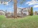 Large backyard featuring a deck with a chiminea, and a large, mature shade tree at 11237 Baycreek Dr, Indianapolis, IN 46236