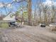 Outdoor wooden deck featuring a grill, dining set, and lounge seating area at 11237 Baycreek Dr, Indianapolis, IN 46236