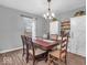 Cozy dining room featuring wood floors, a table, and bright natural lighting at 11237 Baycreek Dr, Indianapolis, IN 46236
