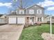 Charming two-story home with a well-manicured lawn, two-car garage, and inviting curb appeal at 11237 Baycreek Dr, Indianapolis, IN 46236