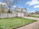 Well-maintained, two-story home with a neatly manicured lawn and three-car garage at 11237 Baycreek Dr, Indianapolis, IN 46236