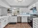 Modern kitchen features white cabinets, stainless steel appliances, and stylish backsplash at 11237 Baycreek Dr, Indianapolis, IN 46236